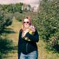 Julia Miller picking apples at the Afton Apple Orchard