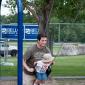Chris and Michael Weber playing on the swings at the Colorado Irish Festival
