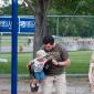 Chris and Michael Weber playing on the swings at the Colorado Irish Festival