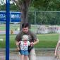 Chris and Michael Weber playing on the swings at the Colorado Irish Festival
