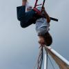 A kid having fun on the bungee jump at the Colorado Irish Festival
