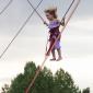 A kid having fun on the bungee jump at the Colorado Irish Festival