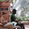 A musician plays on the Pearl Street Mall in Boulder, CO