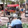A man sketches "Hearts on a Swing" on the Pearl Street Mall in Boulder, CO