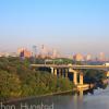 Downtown Minneapolis during rush hour from the Franklin Avenue Bridge. The Interstate 94 bridge across the river can be seen.