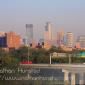 Downtown Minneapolis during rush hour from the Franklin Avenue Bridge. The Interstate 94 bridge across the river can be seen.