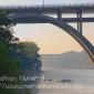 The Franklin Avenue Bridge over the Mississippi River, with the rail crossing in the background.