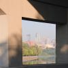 A bridge pier for the Dartmouth Bridge frames downtown Minneapolis.