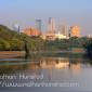 Downtown Minneapolis reflected in the Mississippi River.