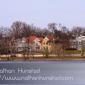 Several stately houses surrounding Lake of the Isles.