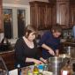Julia Miller, Niki Amundson, and Matt Hunstad working on dinner