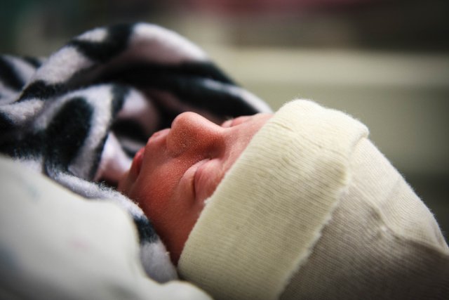 Sonja resting in Mom's arms