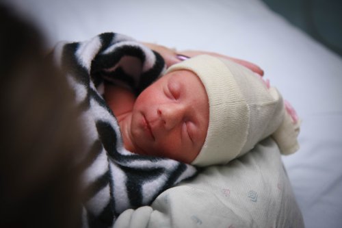 Sonja resting in Mom's arms
