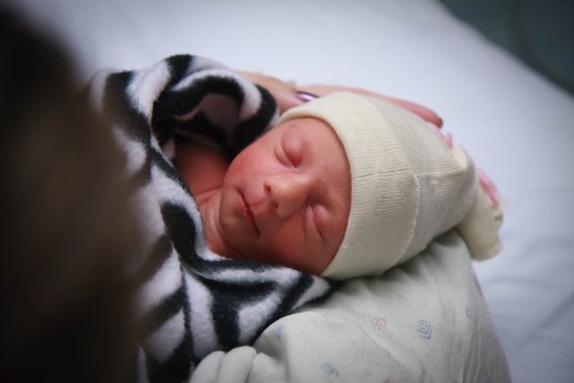 Sonja resting in Mom's arms