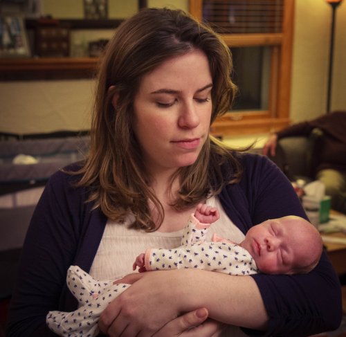 Sonja being held by her mother