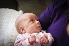 Sonja cuddles in Julia's arms