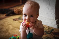 Sonja eating her toys